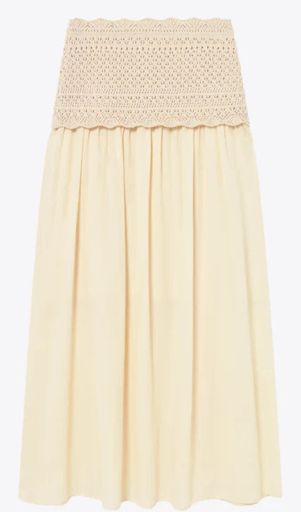 A light cream or pale yellow pleated skirt with a textured crochet lace waistband, shown against a plain white background.