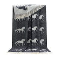 Gray blanket with white horse pattern on a white background