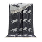 Gray blanket with white horse pattern on a white background