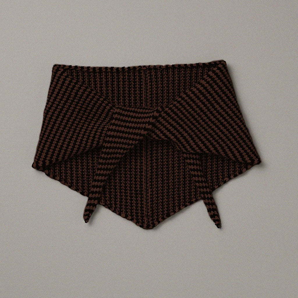 Brown knitted headband on a light gray background
