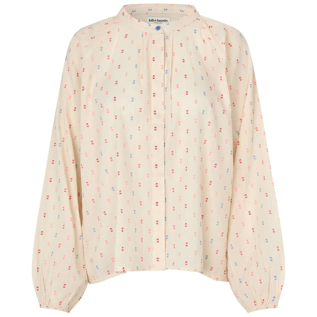 Light pink blouse with subtle pattern on a white background