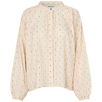 Light pink blouse with subtle pattern on a white background