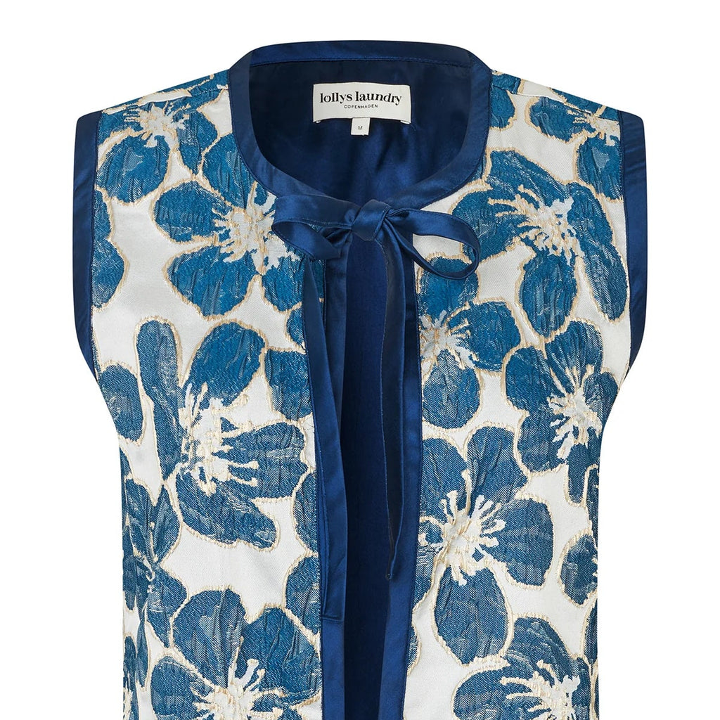 Blue floral patterned vest on a white background