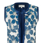 Blue floral patterned vest on a white background