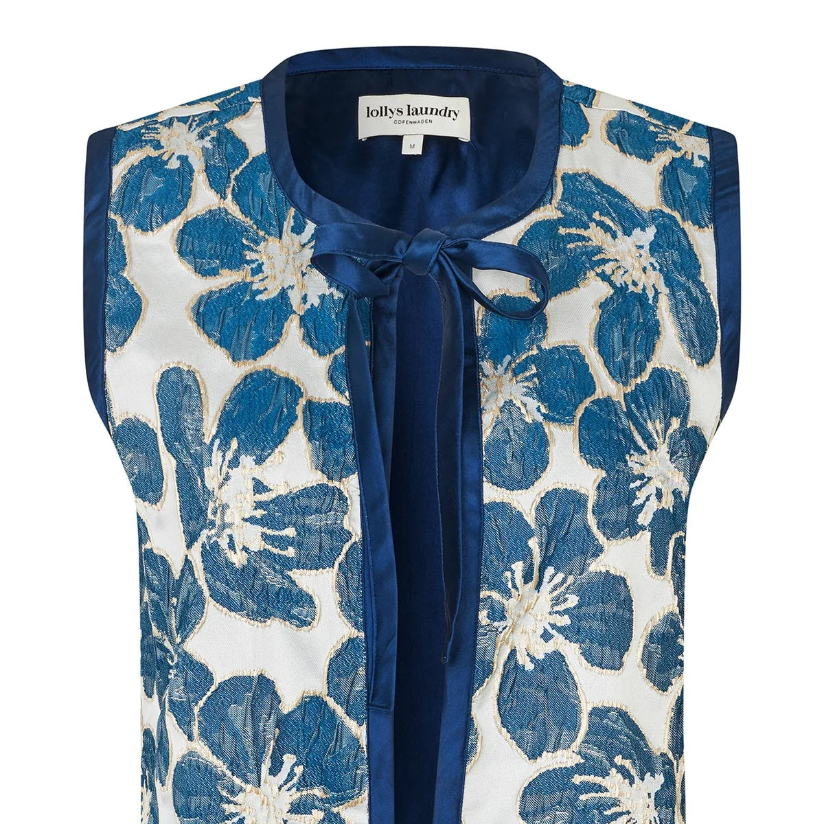 Blue floral patterned vest on a white background