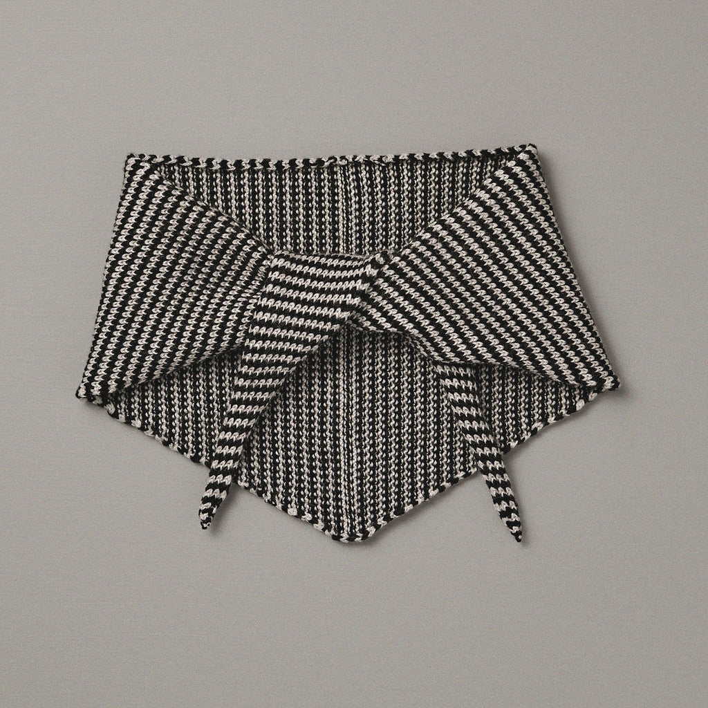 Black and white patterned fabric on a gray background