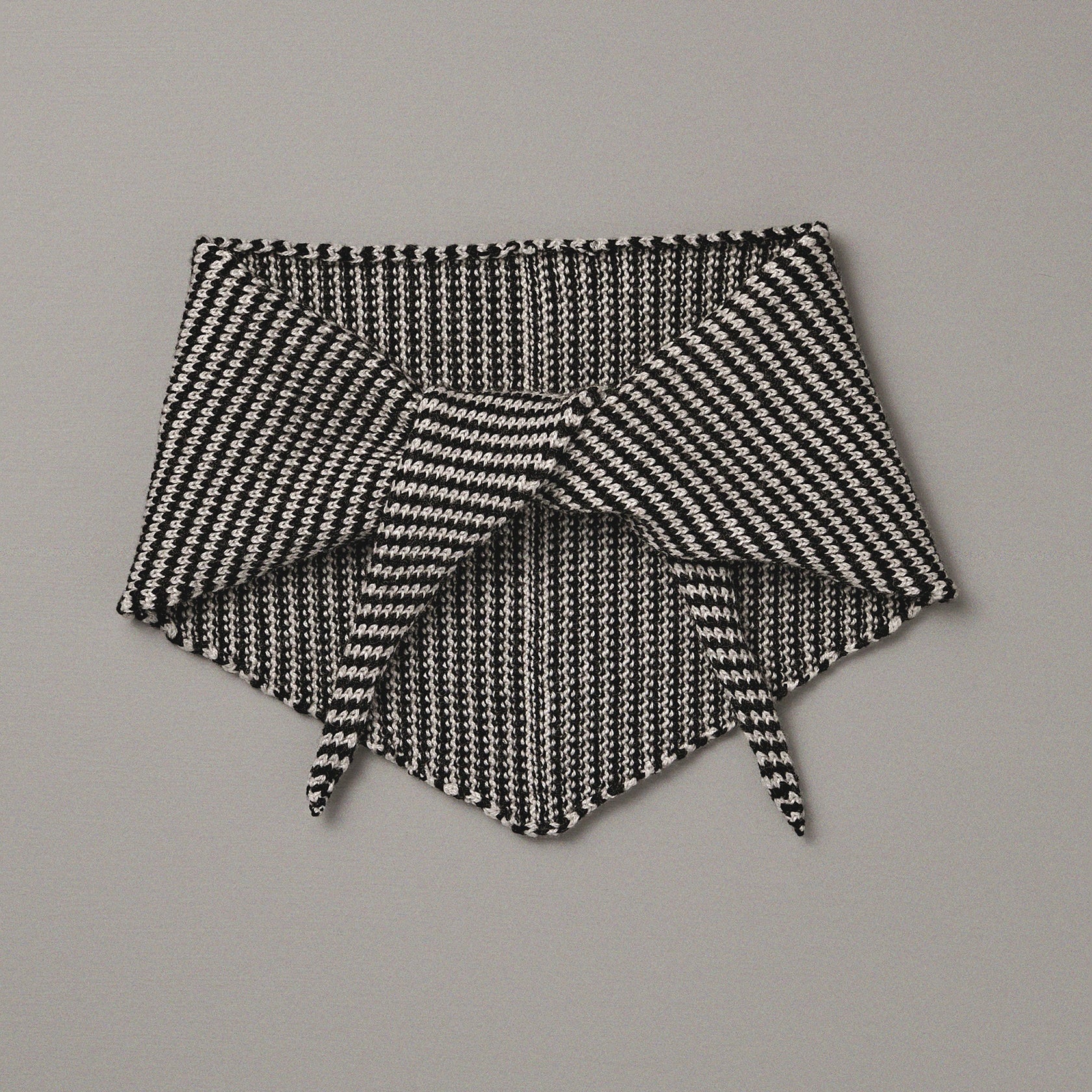 Black and white patterned fabric on a gray background